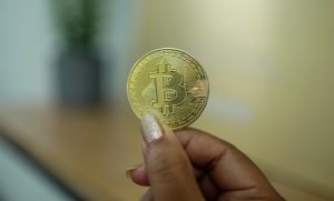 Woman holding Bitcoin